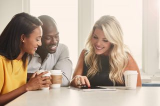 Realtor sitting at table with clients